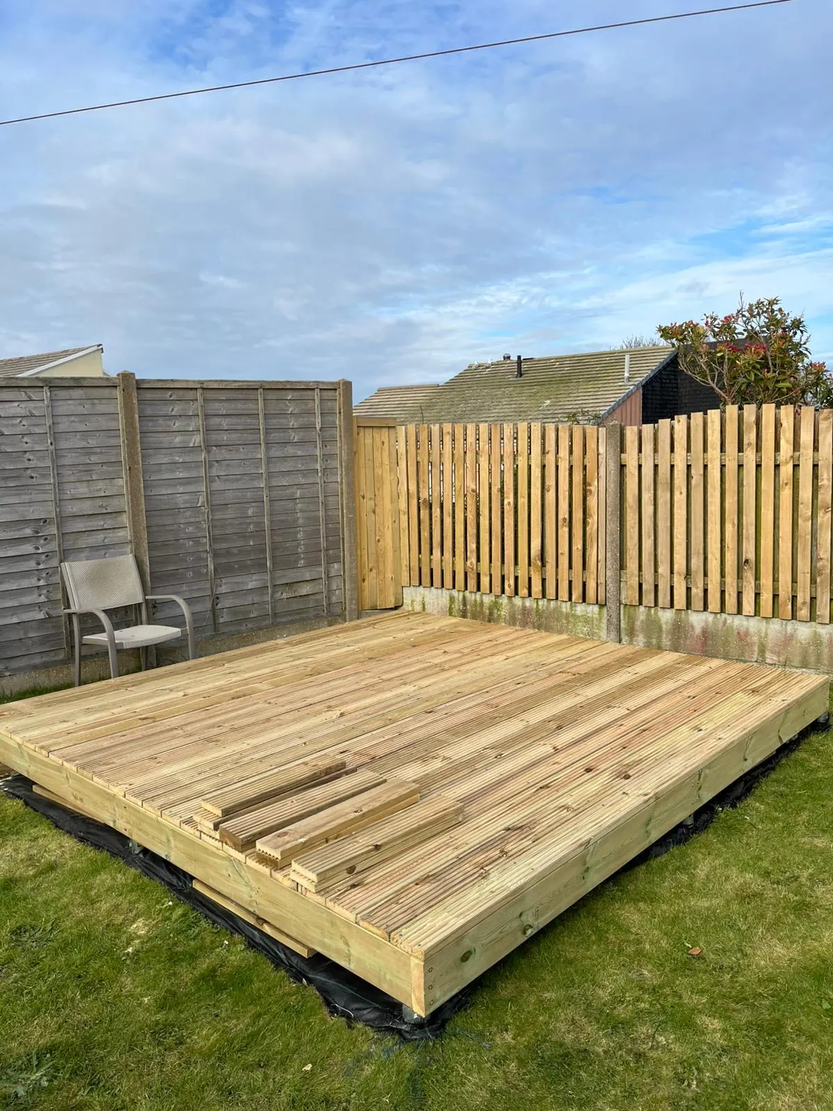 Completed raised timber decking platform installed in a Cornwall garden