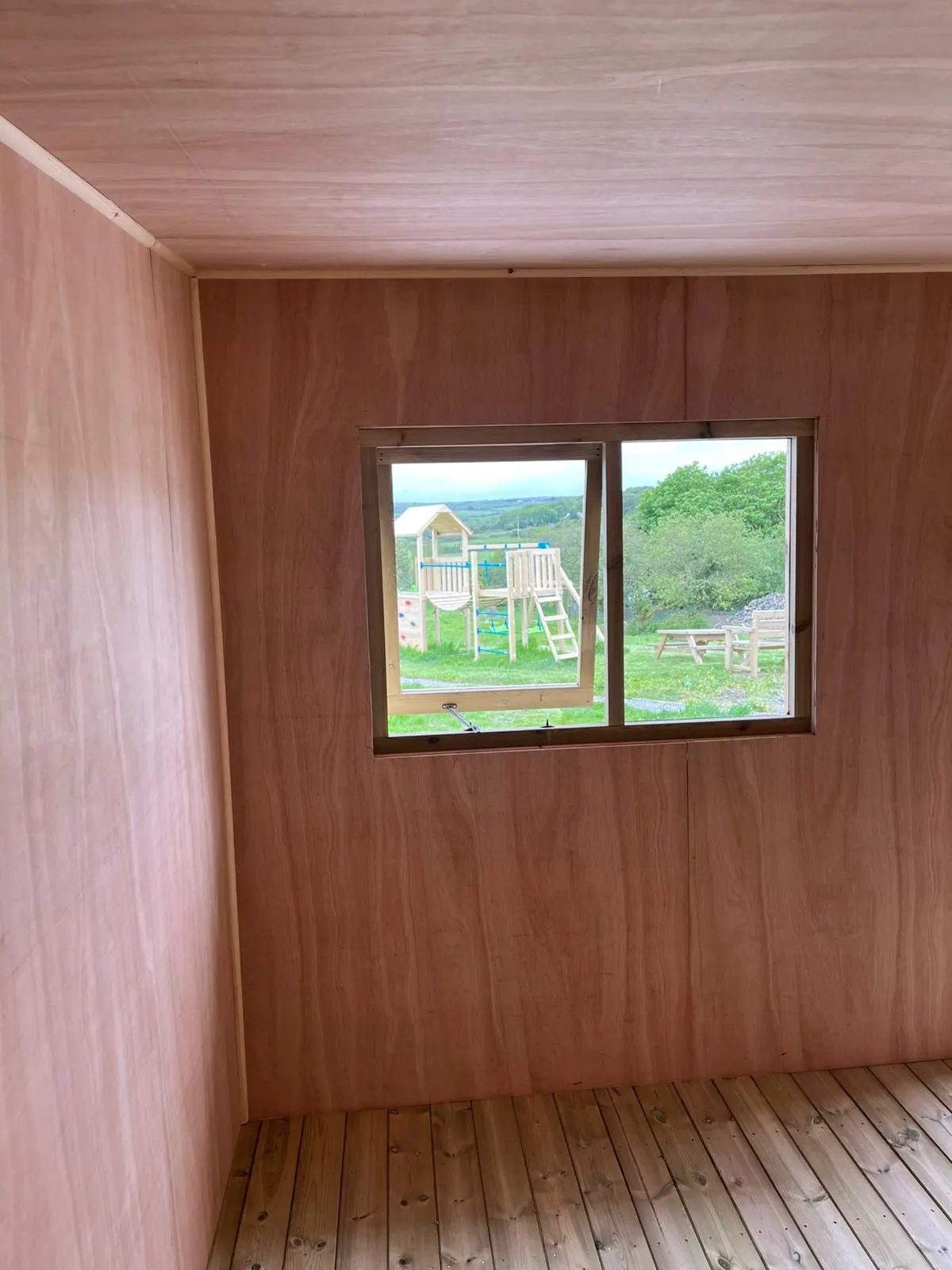 Clean plywood internal lining inside a timber garden room in Cornwall