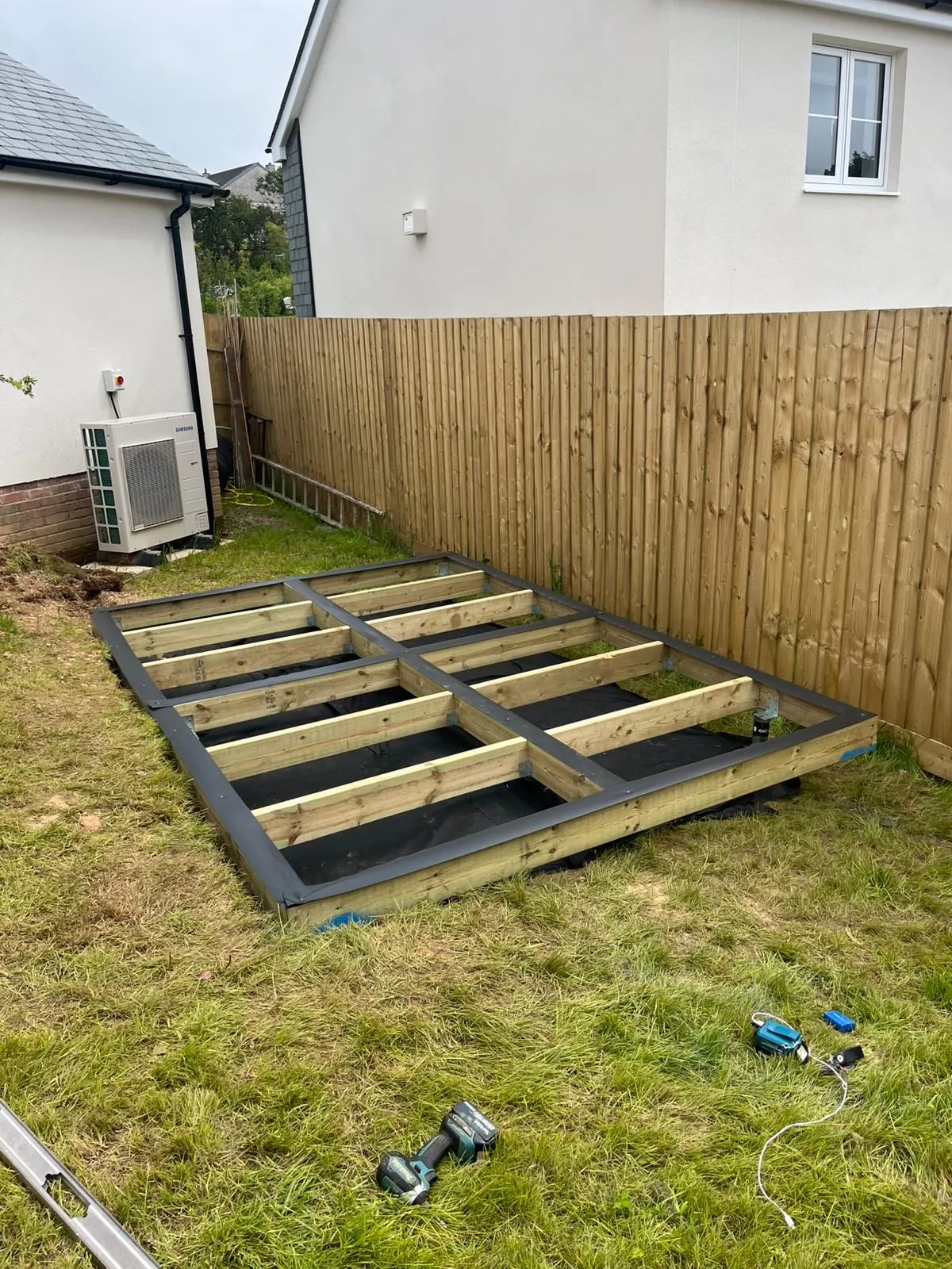Timber ground screw base installed beside a new-build home in Cornwall