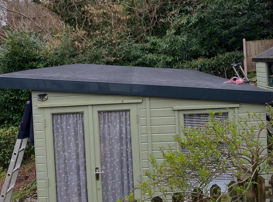 Completed shed roof refelting — clean professional finish